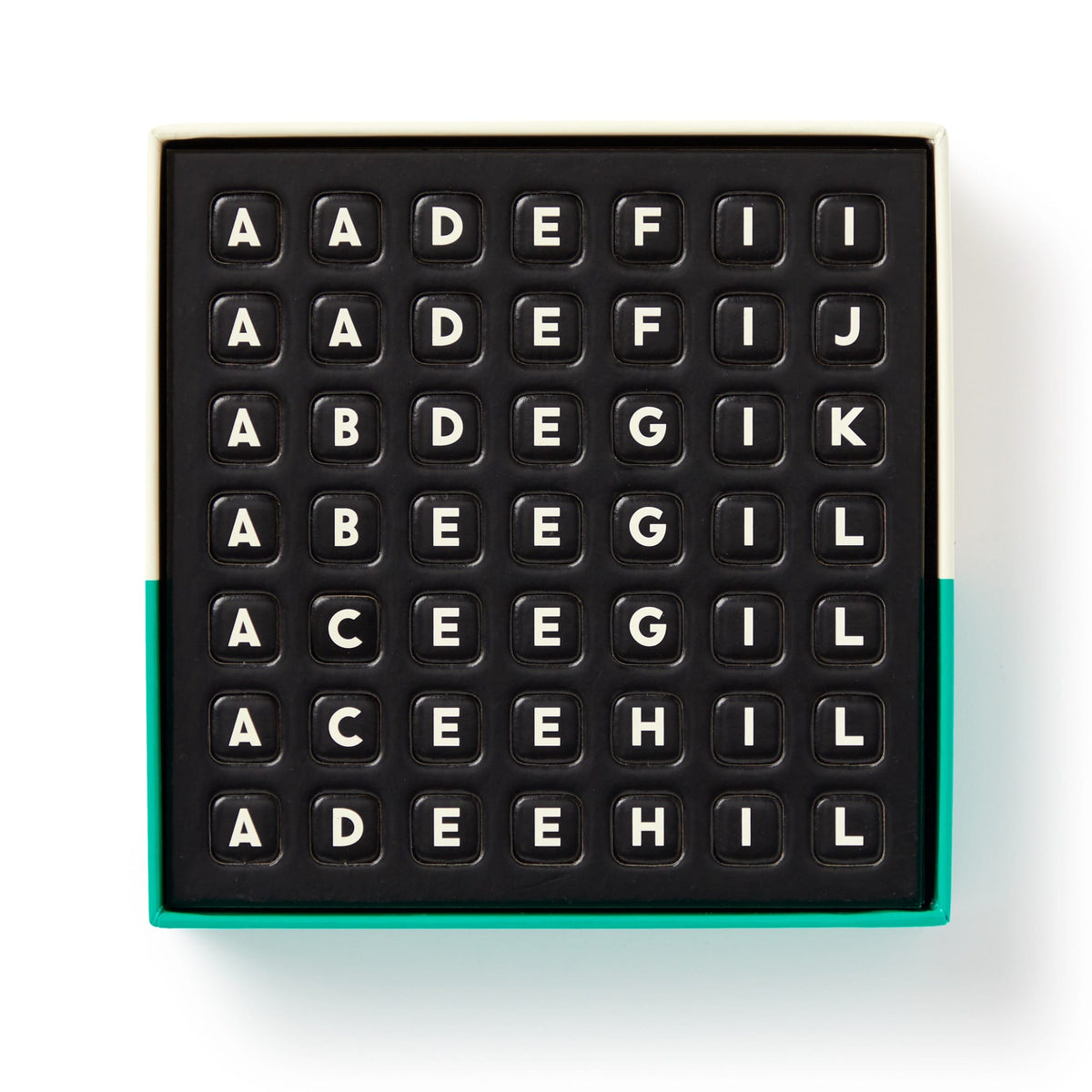 The Scrumble Magnetic Fridge Game by Brass Monkey features black letter tiles with capital letters arranged in rows, similar to crossword magnets, all in a box with a green-edged bottom.