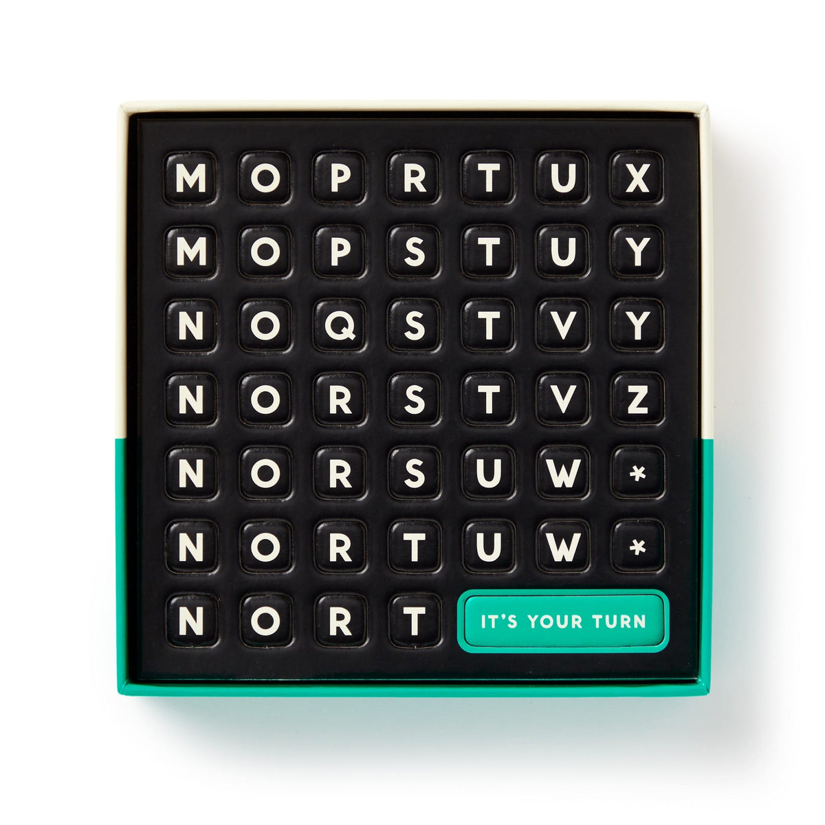 The Brass Monkey Scrumble Magnetic Fridge Game features a black 7x7 crossword-style game board with lettered tiles and a green ITS YOUR TURN tile in the bottom right, all placed in an open box with a green edge.