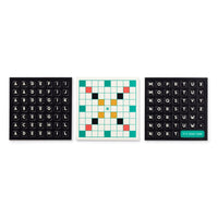 The Scrumble Magnetic Fridge Game by Brass Monkey has three square boards: a crossword-style center grid and fridge magnet-inspired side boards with black tiles and white letters. The right board features a green tile that reads ITS YOUR TURN.