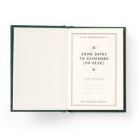 The Brass Monkey Dates People Get Mad If I Forget Tiny Diary is a hard-bound book with gilded edges, featuring spreads like A Tiny Insurance Policy and sections for important dates and personal details.