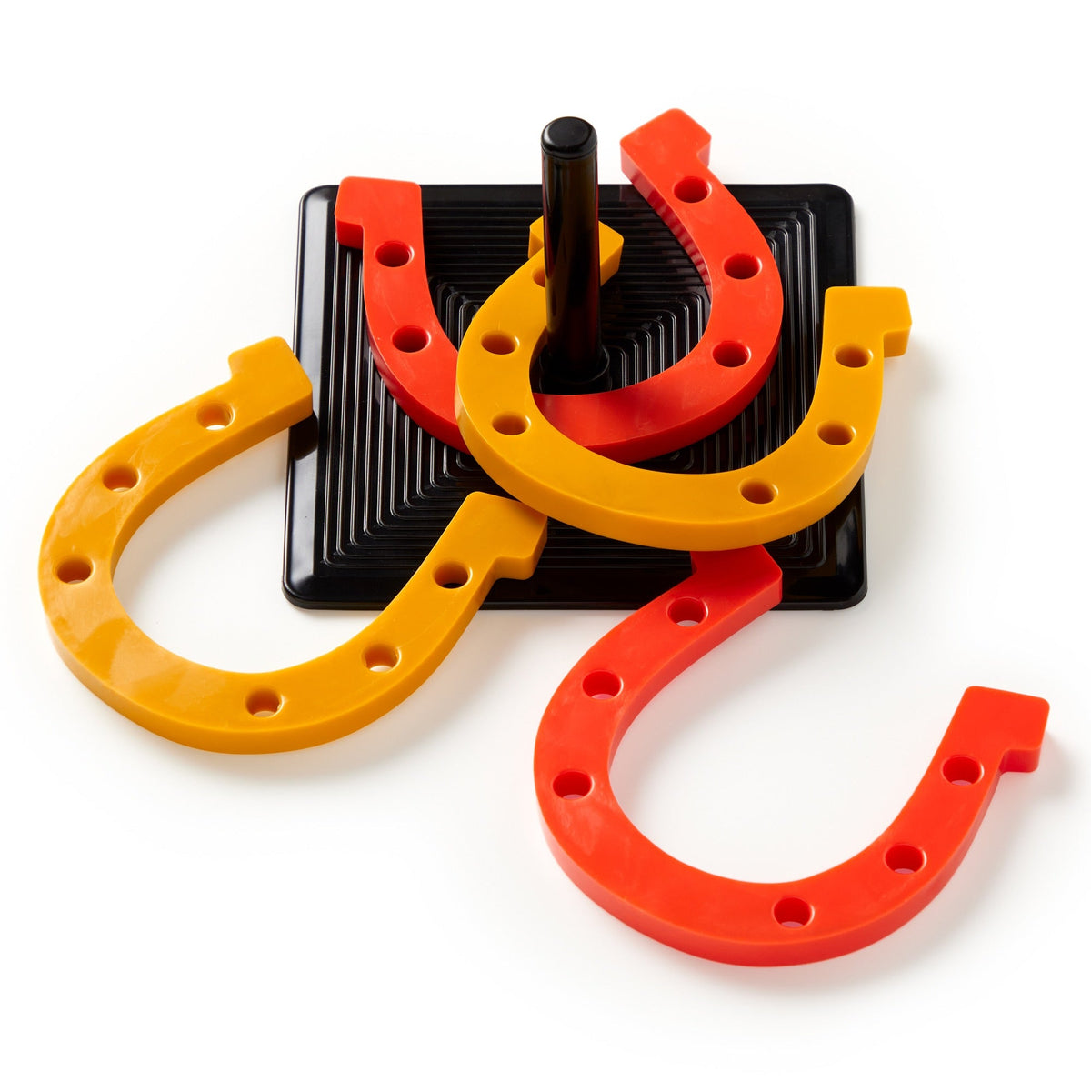 Brass Monkey’s Giddy Up Tabletop Horseshoes Game features two yellow and two orange rubber horseshoes surrounding a black peg on a square black base, making it an ideal party game for indoor fun.