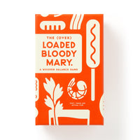 A rectangular orange and white game box from Brass Monkey labeled (Over) Loaded Bloody Mary Balance Game, featuring playful illustrations of garnishes like celery, sausage, and shrimp.