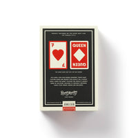 A Big Deal Giant Playing Cards by Brass Monkey are shown in a box featuring oversized red and white cards (a seven of hearts and a queen) on the back, set against a white background, with branding and product details included.