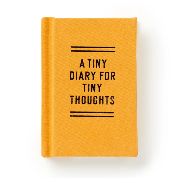 A small yellow hardcover book by Brass Monkey, titled A Tiny Diary for Tiny Thoughts in centered black text on the cover, with two horizontal black lines above and below and gold-edged pages.