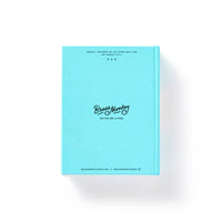 The Bar None Drink Journal by Brass Monkey features a bright turquoise cover with their logo and Shiver Me Timers. slogan. Ideal for collecting cocktail recipes or as a drinking journal, it also includes small text and two web addresses at the bottom.