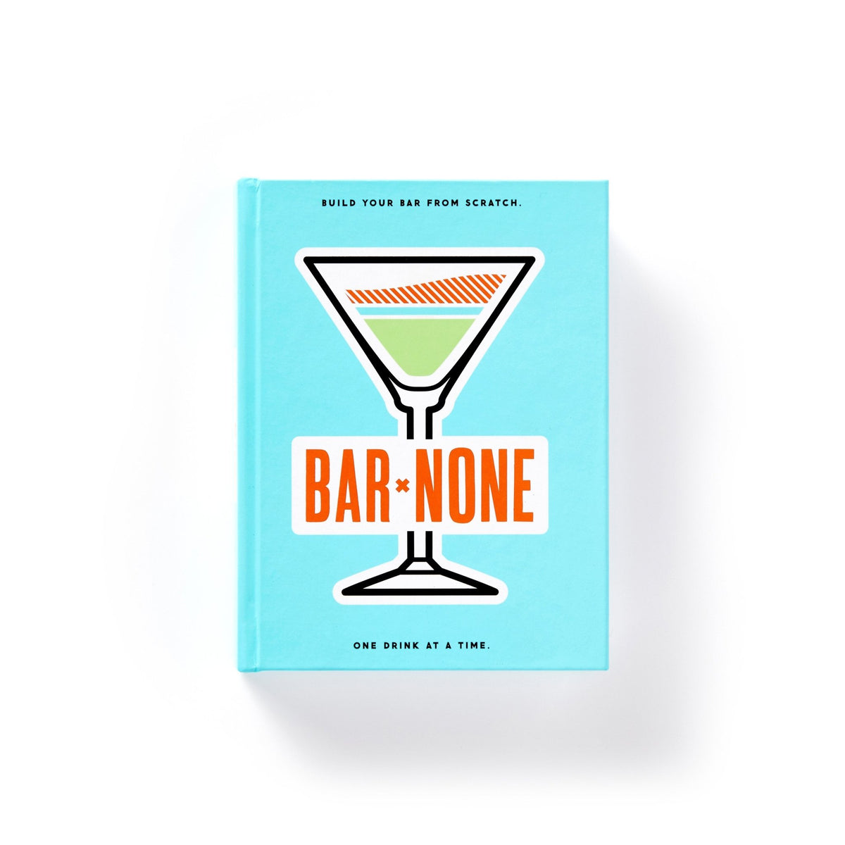 A vibrant blue Bar None Drink Journal by Brass Monkey features a martini glass and bold orange title. The cover invites you to build your bar from scratch with cocktail recipes and inspiration.