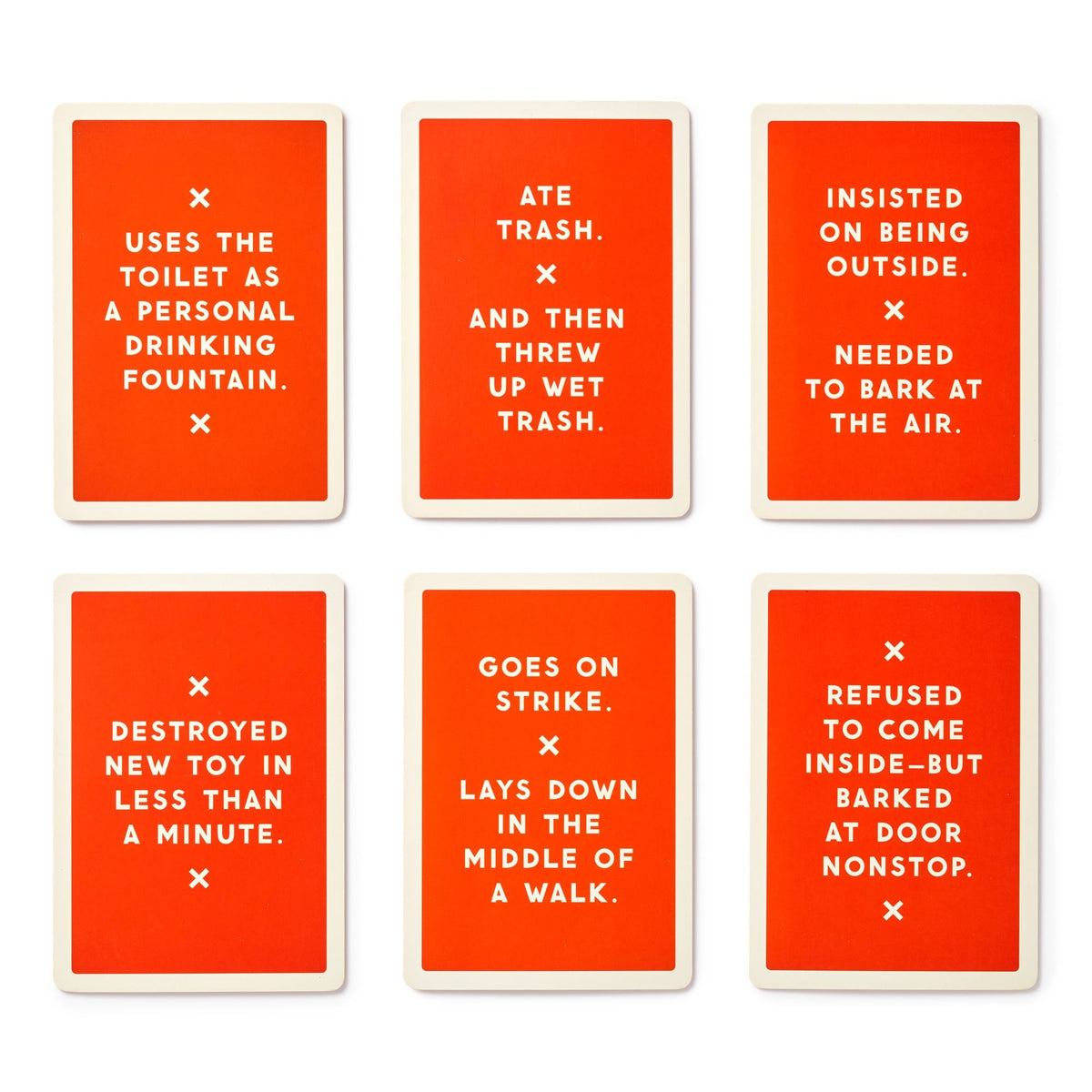 Brass Monkey’s Because This Dog Is Embarrassing Pet Shame/Praise Deck features six orange cards with white text humorously spotlighting classic dog antics like drinking from the toilet, eating trash, barking at nothing, and more.