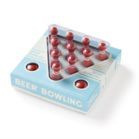 The Brass Monkey Beer Bowling Drinking Game Set includes twelve MDF pins in a triangle and two red bowling balls, all packaged in a light blue and white box—perfect for fun drinking games.