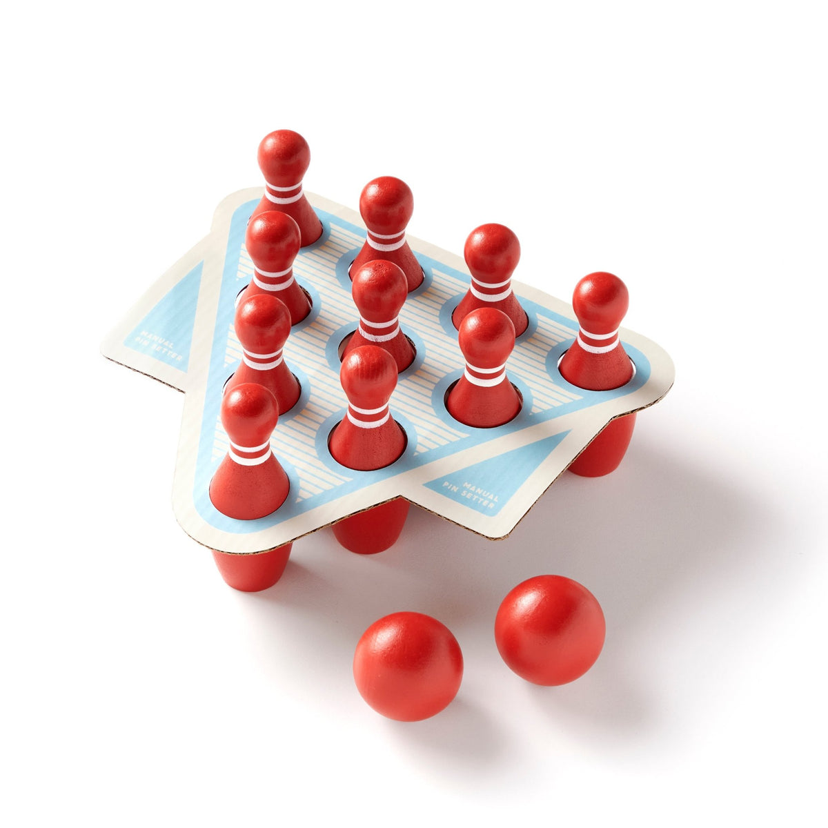 The Brass Monkey Beer Bowling Drinking Game Set features red MDF pins in a triangle rack and three red balls, perfect for tabletop fun.
