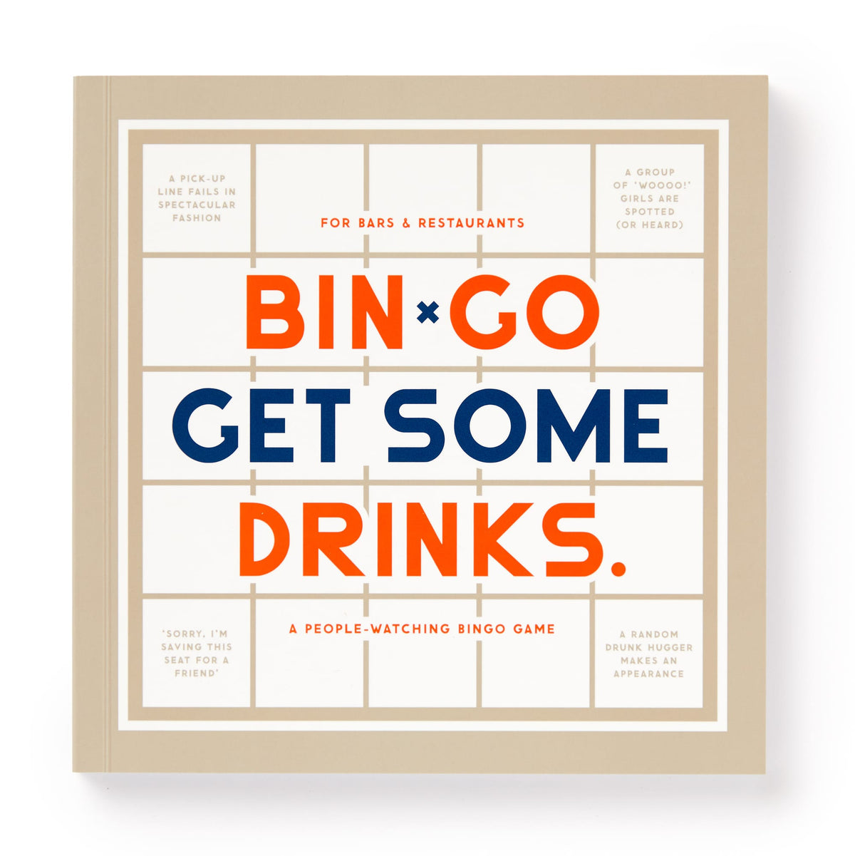 The Brass Monkey Bin-go Get Some Drinks Bingo Book features a beige cover with orange and blue text, plus bingo squares filled with funny bar and restaurant scenarios—ideal for people-watching or classic game fans.