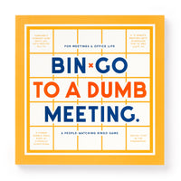 Square book cover with a yellow border, titled “Bin-go To A Dumb Meeting Bingo Book” in bold blue and orange text. Created by Brass Monkey, it’s a meeting bingo and people-watching game ideal for office life.