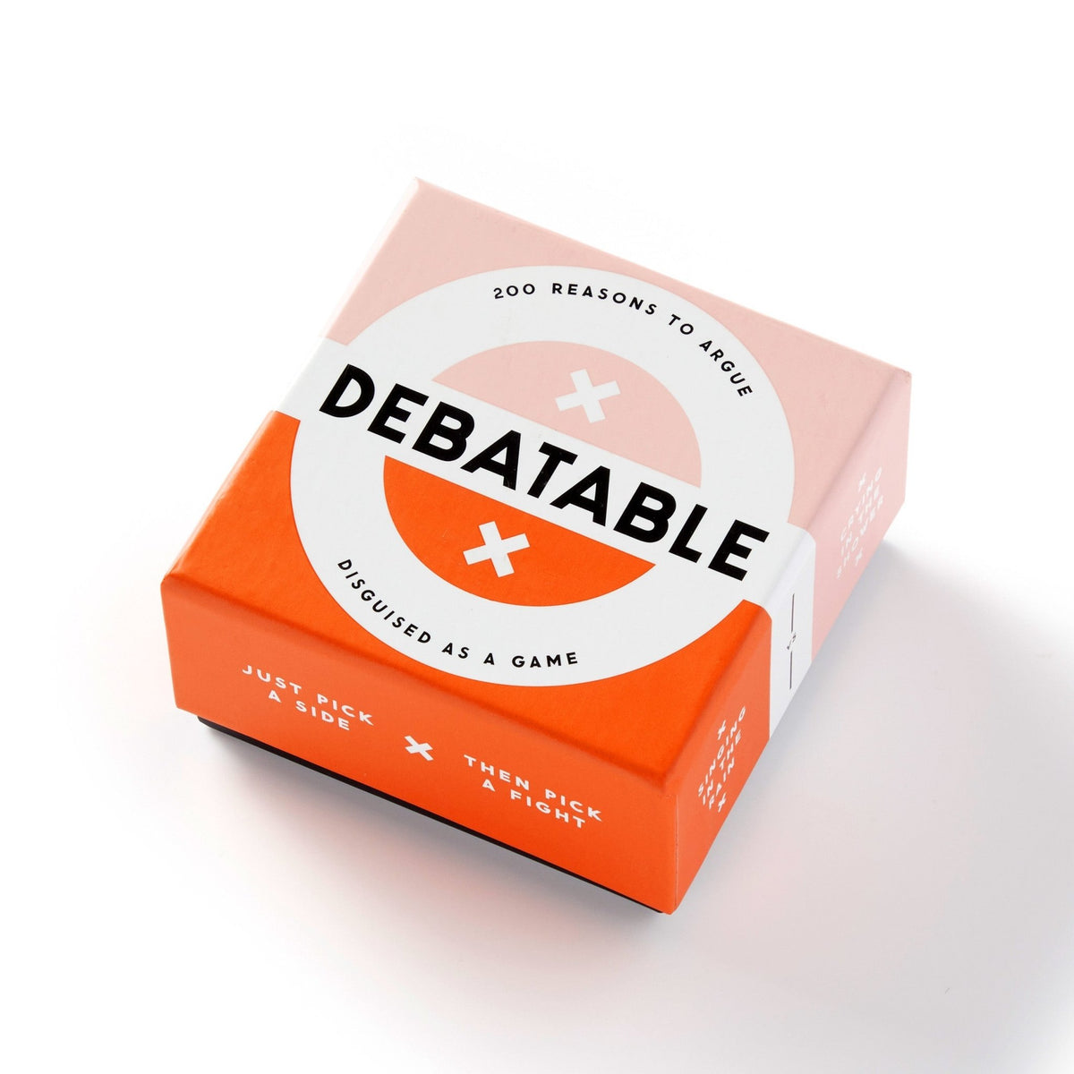 The Debatable Game Set by Brass Monkey comes in a square box with a peach-orange design, bold 200 Reasons to Argue and Disguised as a Game text, and debate cards for lively discussions on hot-button topics.