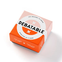 The Debatable Game Set by Brass Monkey comes in a square box with a peach-orange design, bold 200 Reasons to Argue and Disguised as a Game text, and debate cards for lively discussions on hot-button topics.