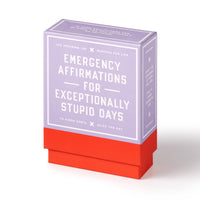 The Brass Monkey Emergency Affirmations for Exceptionally Stupid Days Card Deck includes 100 inspiring-ish affirmation cards in a lavender and red box, perfect for daily motivation.
