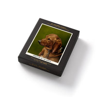 Brass Monkey’s Employee Of The Month 300 Piece Apartment Puzzle features a portrait of a brown dog with long ears and comes in a stylish black box with white and gold text.