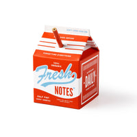 The Brass Monkey Fresh Ideas Milk Carton Note Set features 500+ tear-off sheets and a pencil straw in red-and-white packaging resembling a dairy carton labeled 100% organic.