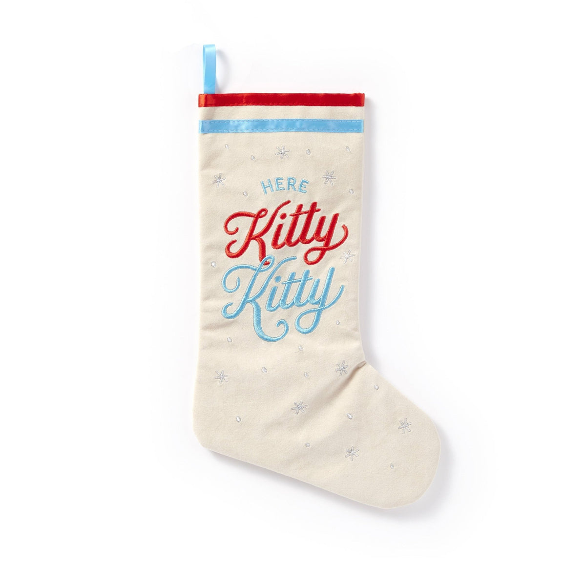 The Here Kitty Kitty Cat Stocking by Brass Monkey features cream velvet with lining, red and blue script embroidery, silver snowflakes, red and blue trim, and a vintage-inspired cat charm.