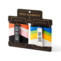 The Brass Monkey Hold My Beer Puffyvest Coozie Set features two colorful vintage-style insulated drink holders, one labeled HOLD MY BEER and the other SEMI-PRO. Each offers adjustable sizing for a perfect fit.