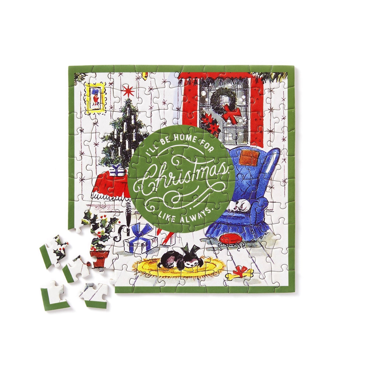 The Brass Monkey Home For Christmas 100 Piece Mini Shaped Puzzle features a festive room scene with pets, tree, and gifts, plus “I’ll be home for Christmas like always” in the center. Four pieces are missing—perfectly packaged for holiday gifting!.