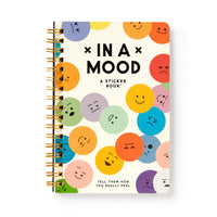 Brass Monkey’s In A Mood Sticker Book is spiral-bound and features colorful emoticon circles on the cover, with the subtitle: Tell them how you really feel.