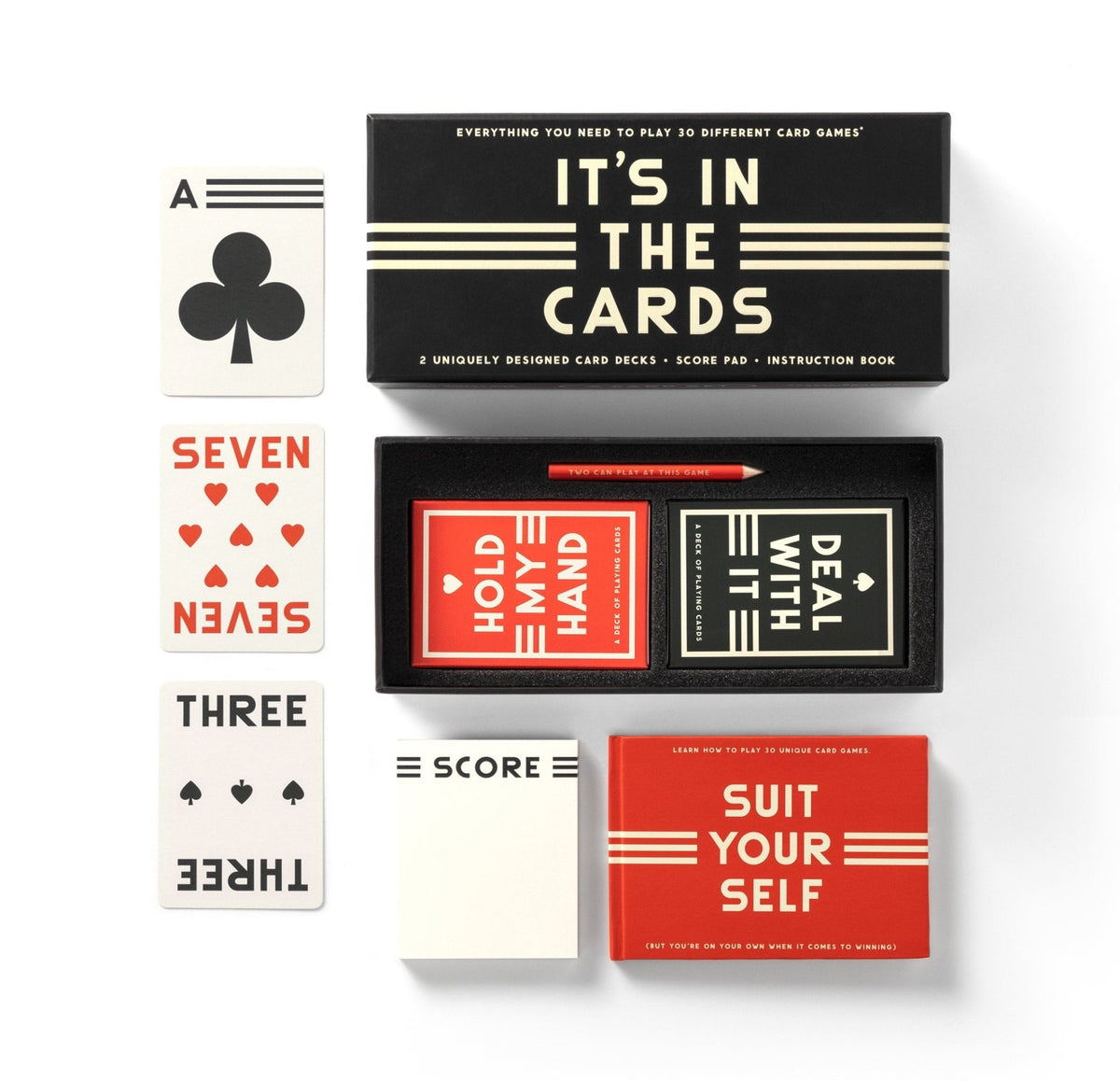 The Brass Monkey “It’s In The Cards Playing Card Game Set” includes two decks, a score pad, and instruction book. Shown with the ace of clubs, seven of hearts, and three of clubs alongside the box and accessories.