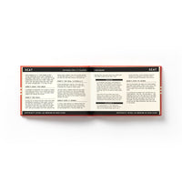 Open book from Brass Monkey’s Its In The Cards Playing Card Game Set shows Scat instructions—covering needed cards, goals, gameplay, scoring, and difficulty—all in black and white text.