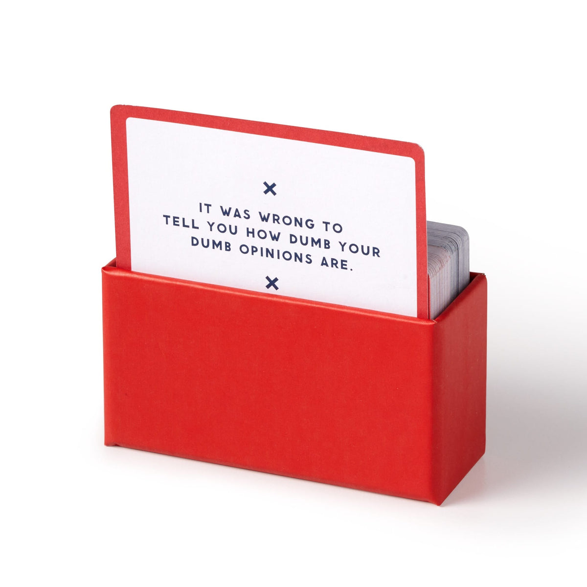 Brass Monkey’s Oddly Specific Apologies is a portable box of unique cards. The top card, partly pulled out, reads: IT WAS WRONG TO TELL YOU HOW DUMB YOUR DUMB OPINIONS ARE. in bold black text on a white background.