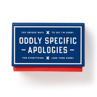 Brass Monkey’s Oddly Specific Apologies is a blue and red rectangular portable box with white text: “100 unique ways to say I’m sorry,” featuring unique apology cards inside for every situation (and then some).