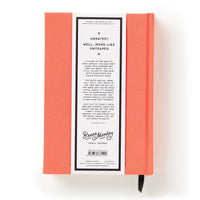 The Part-Time Adult Undated Daily Planner by Brass Monkey features a coral hardcover, a white back label with playful undated text, barcode, and Brass Monkey logo. A black ribbon bookmark emerges from the bottom.
