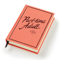The Brass Monkey Part-Time Adult Undated Daily Planner features a coral hardcover with the title in black cursive and print, and comes with a black ribbon bookmark.