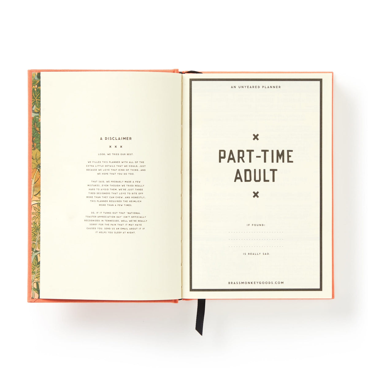 An open Part-Time Adult Undated Daily Planner by Brass Monkey displays a left-page disclaimer in small print, a large “PART-TIME ADULT” title on the right, a website at the bottom, and features a black ribbon bookmark.