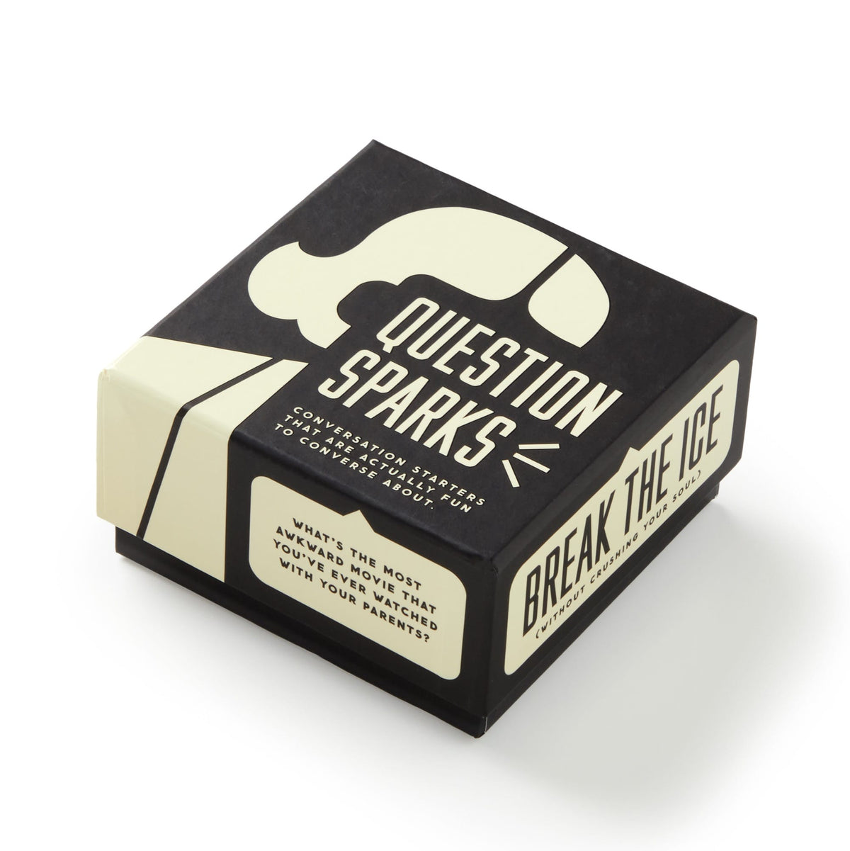 A black and cream Question Sparks box by Brass Monkey, filled with conversation starter cards, sits against a white background. BREAK THE ICE appears on the side and a sample question is printed on the edge.