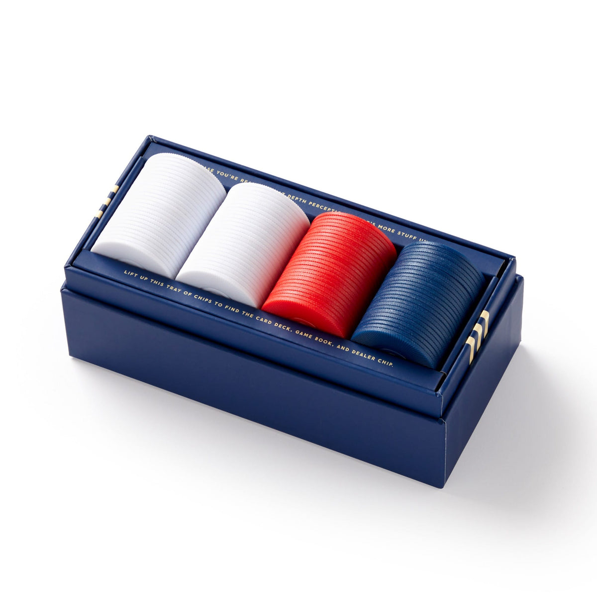 The Brass Monkey Raise The Stakes Poker Game Set features a rectangular blue box with four side-by-side stacks of white, red, and blue poker chips—an essential addition to any classic poker setup.
