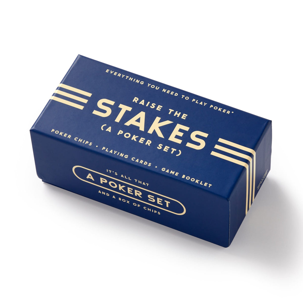 The Raise The Stakes Poker Game Set by Brass Monkey comes in a blue rectangular box with white and gold accents, featuring poker chips, a deck of cards, and a game booklet.