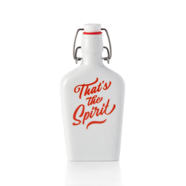 The Brass Monkey Thats The Spirit Porcelain Flask is a vintage-inspired flask with a swing-top lid, metal clasp, and red “That’s the Spirit” text on the front.