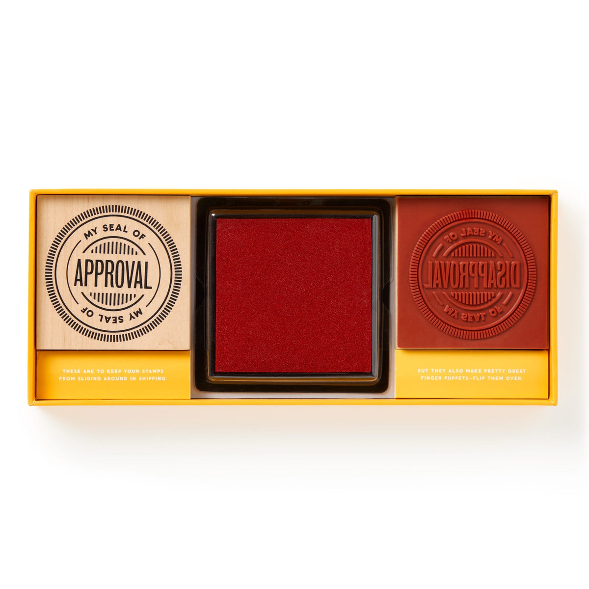The Brass Monkey Your Seal Of Approval Stamp Set includes two large red stamps—My Seal of Approval and My Seal of Disapproval—plus a large color inkpad, all in a rectangular yellow box.