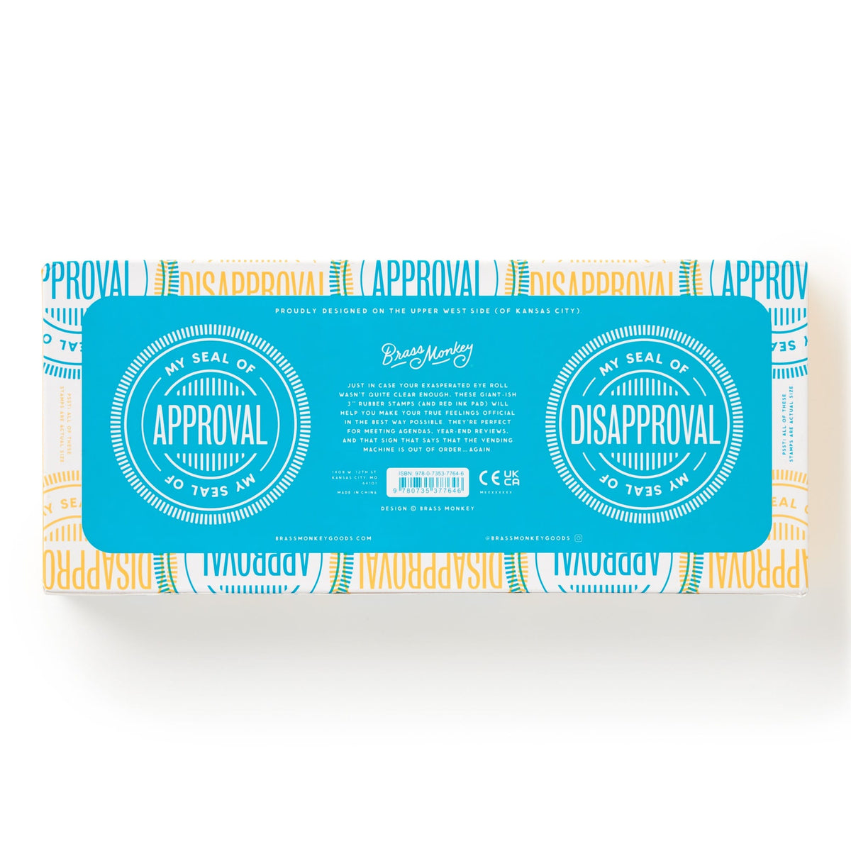 A rectangular box from Brass Monkey, labeled “Your Seal Of Approval Stamp Set,” features blue accents and two circles marked “My Seal of Approval” and “My Seal of Disapproval” over a background repeating “APPROVAL” and “DISAPPROVAL.”.