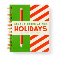 A spiral-bound book by Brass Monkey called Beyond Bored At The Holidays, featuring a green and red striped cover with a large pencil illustration and the cheeky line “Not that kind. Pervert.” at the bottom.