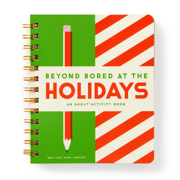 A spiral-bound book by Brass Monkey called Beyond Bored At The Holidays, featuring a green and red striped cover with a large pencil illustration and the cheeky line “Not that kind. Pervert.” at the bottom.