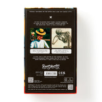 The back of the Brass Monkey Oddly Correct Party Game box displays quirky images, funny captions, and instructions, along with various logos and QR codes at the bottom.