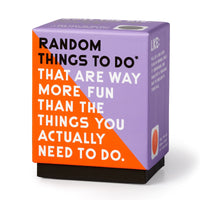 A Brass Monkey Random Things To Do Box in purple and orange stands upright on a white background, featuring the text: RANDOM THINGS TO DO* THAT ARE WAY MORE FUN THAN THE THINGS YOU ACTUALLY NEED TO DO.