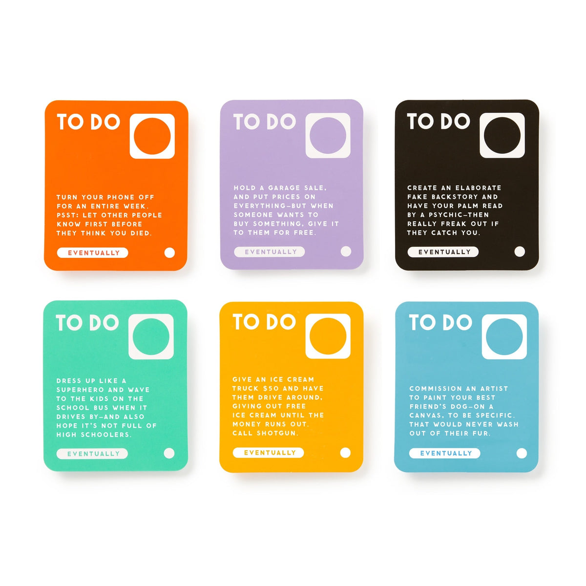 Brass Monkey’s Random Things To Do Box includes six colorful cards featuring playful tasks—like turning off your phone, holding a garage sale, or giving ice cream to a child—with “EVENTUALLY” marked at the bottom of each.