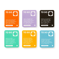 Brass Monkey’s Random Things To Do Box includes six colorful cards featuring playful tasks—like turning off your phone, holding a garage sale, or giving ice cream to a child—with “EVENTUALLY” marked at the bottom of each.