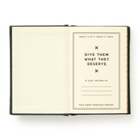 An open Brass Monkey Naughty and/or Nice Tiny Diary displays a page with bold text: “Give them what they deserve.” Spaces for contact details appear, along with smaller lines: “Make a list & check it once” and “Talk about needless rework.”.