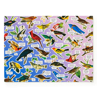 A vibrant collage of illustrated birds with labeled name tags on a gradient background, the Salty Birds 1000 Piece Puzzle by Brass Monkey is perfect for bird lovers and anyone seeking a colorful jigsaw challenge.
