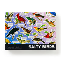 The Brass Monkey Salty Birds 1000 Piece Puzzle features illustrated birds with funny speech bubbles on a purple background and comes with four bonus puffy stickers for extra fun.